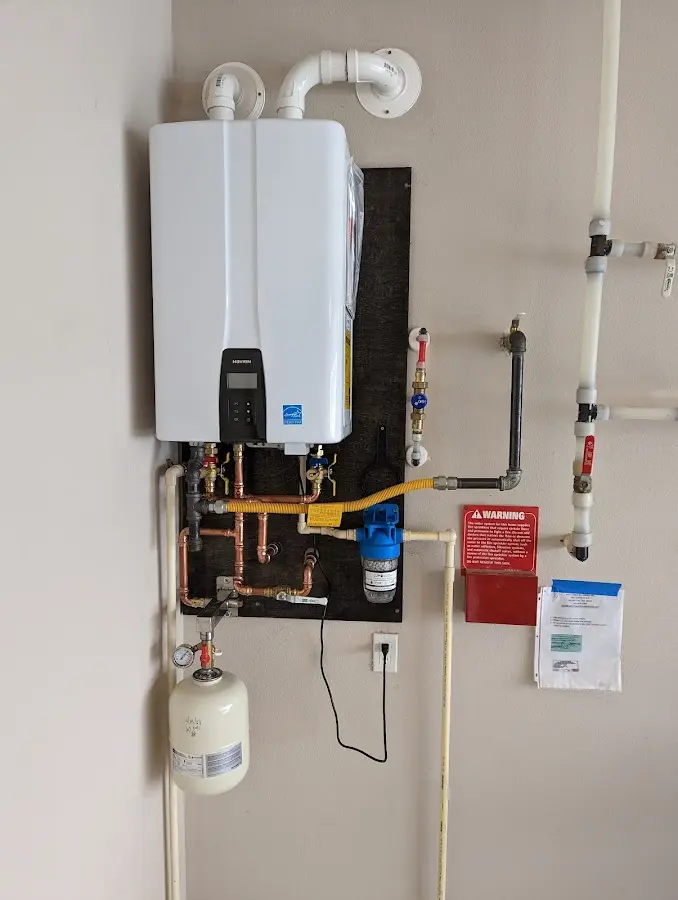 Professional plumber installing copper piping in a West Pottsgrove home